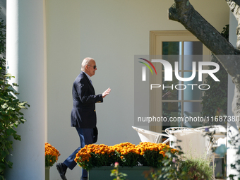 US President Joe Biden walks to the Oval Office after landing on the South Lawn of the White House in Washington, DC, on October 20, 2024, a...