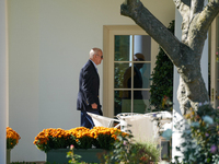 US President Joe Biden walks to the Oval Office after landing on the South Lawn of the White House in Washington, DC, on October 20, 2024, a...