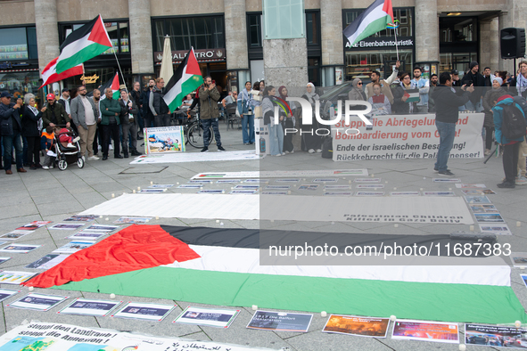 A hundred pro-Palestinian activists take part in a weekly demonstration in front of the Dom Cathedral  in Cologne, Germany, on October 20, 2...