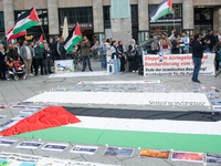 A hundred pro-Palestinian activists take part in a weekly demonstration in front of the Dom Cathedral  in Cologne, Germany, on October 20, 2...