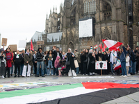 A hundred pro-Palestinian activists take part in a weekly demonstration in front of the Dom Cathedral  in Cologne, Germany, on October 20, 2...