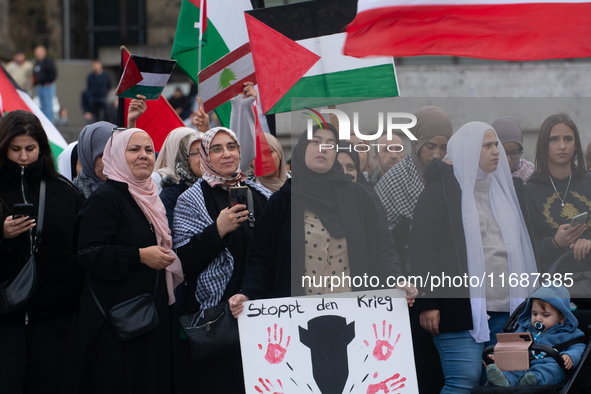 A hundred pro-Palestinian activists take part in a weekly demonstration in front of the Dom Cathedral  in Cologne, Germany, on October 20, 2...