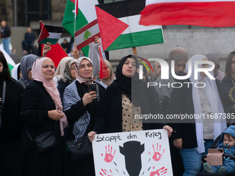 A hundred pro-Palestinian activists take part in a weekly demonstration in front of the Dom Cathedral  in Cologne, Germany, on October 20, 2...