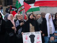 A hundred pro-Palestinian activists take part in a weekly demonstration in front of the Dom Cathedral  in Cologne, Germany, on October 20, 2...