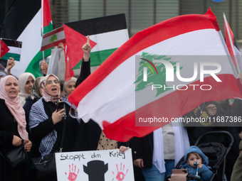 A hundred pro-Palestinian activists take part in a weekly demonstration in front of the Dom Cathedral  in Cologne, Germany, on October 20, 2...