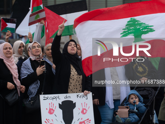 A hundred pro-Palestinian activists take part in a weekly demonstration in front of the Dom Cathedral  in Cologne, Germany, on October 20, 2...