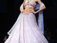 A model walks the ramp showcasing a designer collection during the 'Shaadiyan' season-5 fashion show in Jaipur, Rajasthan, India, on October...