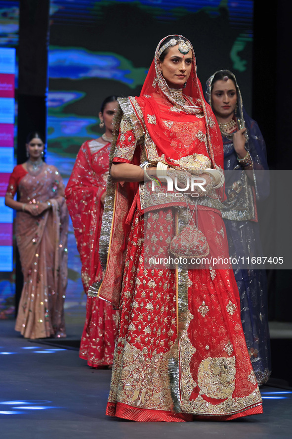 Models walk the ramp showcasing a designer collection during the 'Shaadiyan' season-5 fashion show in Jaipur, Rajasthan, India, on October 1...