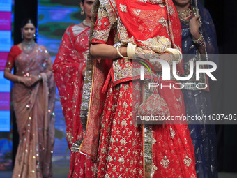 Models walk the ramp showcasing a designer collection during the 'Shaadiyan' season-5 fashion show in Jaipur, Rajasthan, India, on October 1...