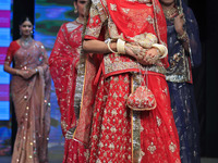 Models walk the ramp showcasing a designer collection during the 'Shaadiyan' season-5 fashion show in Jaipur, Rajasthan, India, on October 1...