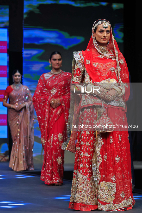 Models walk the ramp showcasing a designer collection during the 'Shaadiyan' season-5 fashion show in Jaipur, Rajasthan, India, on October 1...