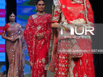 Models walk the ramp showcasing a designer collection during the 'Shaadiyan' season-5 fashion show in Jaipur, Rajasthan, India, on October 1...