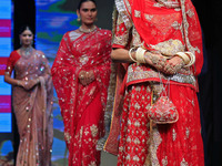 Models walk the ramp showcasing a designer collection during the 'Shaadiyan' season-5 fashion show in Jaipur, Rajasthan, India, on October 1...