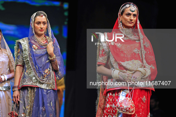 Models walk the ramp showcasing a designer collection during the 'Shaadiyan' season-5 fashion show in Jaipur, Rajasthan, India, on October 1...