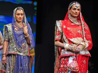 Models walk the ramp showcasing a designer collection during the 'Shaadiyan' season-5 fashion show in Jaipur, Rajasthan, India, on October 1...