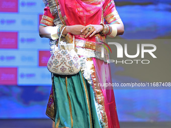 A model walks the ramp showcasing a designer collection during the 'Shaadiyan' season-5 fashion show in Jaipur, Rajasthan, India, on October...