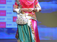 A model walks the ramp showcasing a designer collection during the 'Shaadiyan' season-5 fashion show in Jaipur, Rajasthan, India, on October...