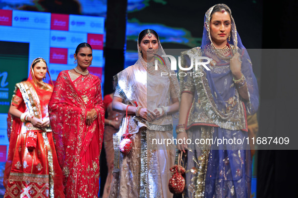 Models walk the ramp showcasing a designer collection during the 'Shaadiyan' season-5 fashion show in Jaipur, Rajasthan, India, on October 1...