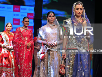 Models walk the ramp showcasing a designer collection during the 'Shaadiyan' season-5 fashion show in Jaipur, Rajasthan, India, on October 1...