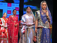 Models walk the ramp showcasing a designer collection during the 'Shaadiyan' season-5 fashion show in Jaipur, Rajasthan, India, on October 1...