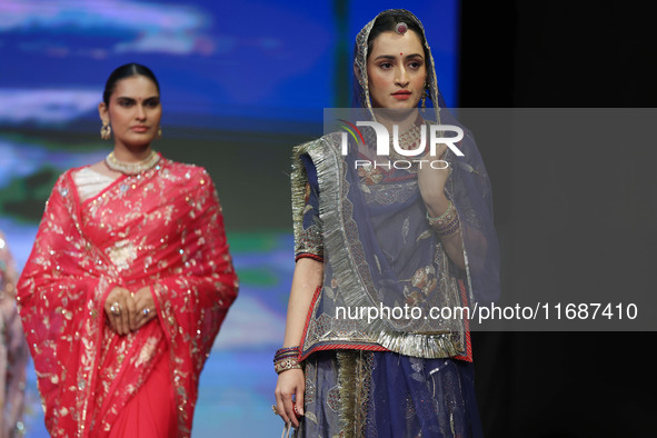 Models walk the ramp showcasing a designer collection during the 'Shaadiyan' season-5 fashion show in Jaipur, Rajasthan, India, on October 1...