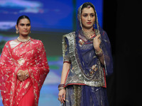 Models walk the ramp showcasing a designer collection during the 'Shaadiyan' season-5 fashion show in Jaipur, Rajasthan, India, on October 1...