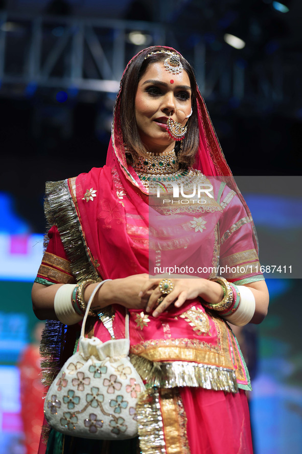 A model walks the ramp showcasing a designer collection during the 'Shaadiyan' season-5 fashion show in Jaipur, Rajasthan, India, on October...