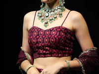 A model walks the ramp showcasing a designer collection during the 'Shaadiyan' season-5 fashion show in Jaipur, Rajasthan, India, on October...