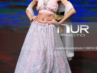 A model walks the ramp showcasing a designer collection during the 'Shaadiyan' season-5 fashion show in Jaipur, Rajasthan, India, on October...