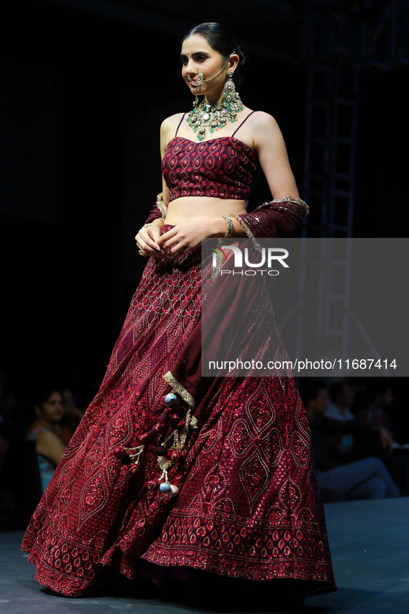 A model walks the ramp showcasing a designer collection during the 'Shaadiyan' season-5 fashion show in Jaipur, Rajasthan, India, on October...