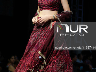 A model walks the ramp showcasing a designer collection during the 'Shaadiyan' season-5 fashion show in Jaipur, Rajasthan, India, on October...