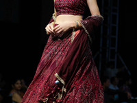 A model walks the ramp showcasing a designer collection during the 'Shaadiyan' season-5 fashion show in Jaipur, Rajasthan, India, on October...