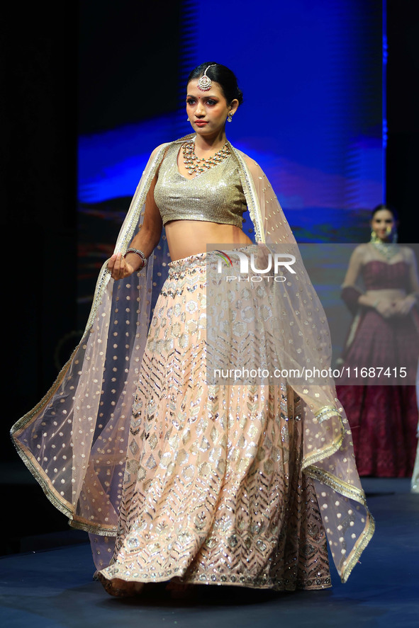 A model walks the ramp showcasing a designer collection during the 'Shaadiyan' season-5 fashion show in Jaipur, Rajasthan, India, on October...