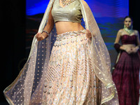 A model walks the ramp showcasing a designer collection during the 'Shaadiyan' season-5 fashion show in Jaipur, Rajasthan, India, on October...