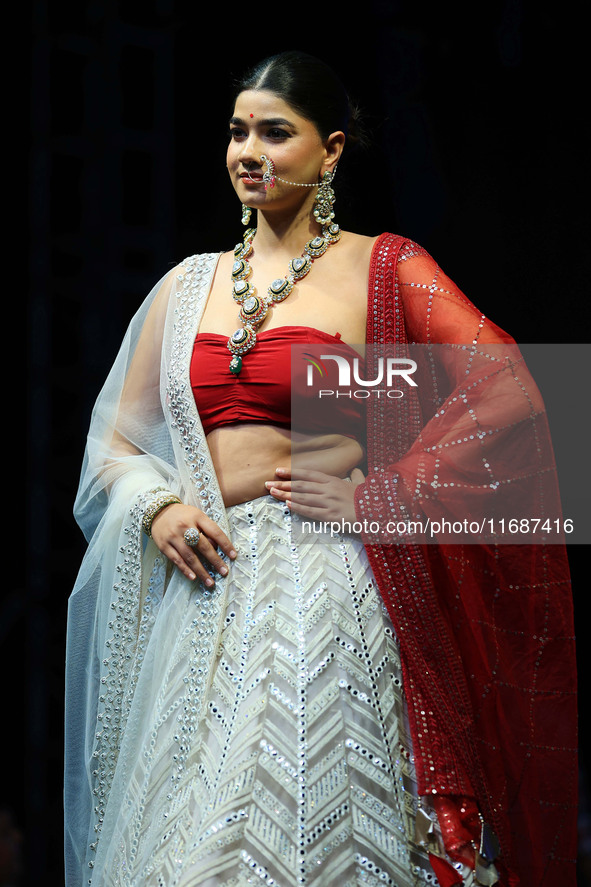 A model walks the ramp showcasing a designer collection during the 'Shaadiyan' season-5 fashion show in Jaipur, Rajasthan, India, on October...