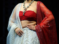 A model walks the ramp showcasing a designer collection during the 'Shaadiyan' season-5 fashion show in Jaipur, Rajasthan, India, on October...