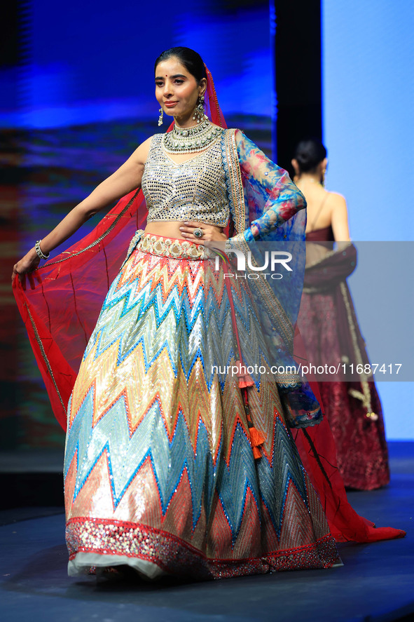 A model walks the ramp showcasing a designer collection during the 'Shaadiyan' season-5 fashion show in Jaipur, Rajasthan, India, on October...