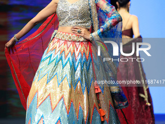 A model walks the ramp showcasing a designer collection during the 'Shaadiyan' season-5 fashion show in Jaipur, Rajasthan, India, on October...