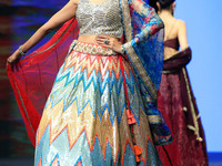 A model walks the ramp showcasing a designer collection during the 'Shaadiyan' season-5 fashion show in Jaipur, Rajasthan, India, on October...