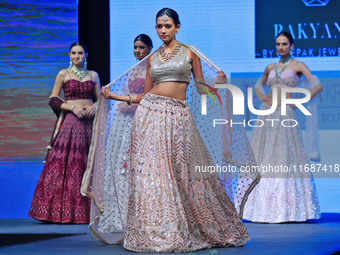 Models walk the ramp showcasing a designer collection during the 'Shaadiyan' season-5 fashion show in Jaipur, Rajasthan, India, on October 1...