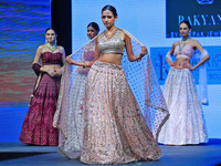 Models walk the ramp showcasing a designer collection during the 'Shaadiyan' season-5 fashion show in Jaipur, Rajasthan, India, on October 1...