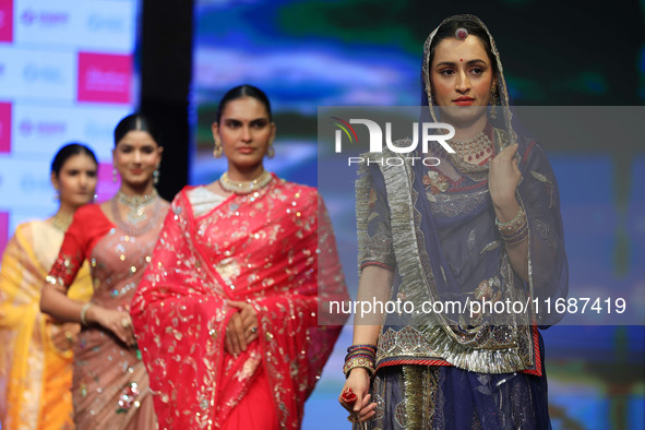 Models walk the ramp showcasing a designer collection during the 'Shaadiyan' season-5 fashion show in Jaipur, Rajasthan, India, on October 1...