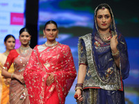 Models walk the ramp showcasing a designer collection during the 'Shaadiyan' season-5 fashion show in Jaipur, Rajasthan, India, on October 1...