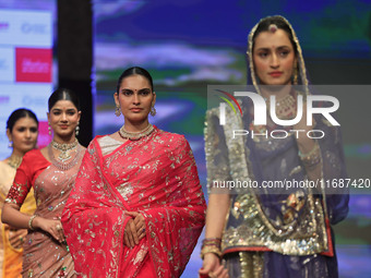 Models walk the ramp showcasing a designer collection during the 'Shaadiyan' season-5 fashion show in Jaipur, Rajasthan, India, on October 1...