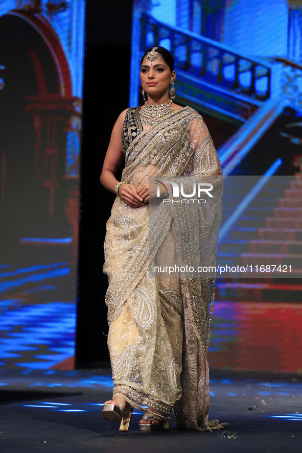 A model walks the ramp showcasing a designer collection during the 'Shaadiyan' season-5 fashion show in Jaipur, Rajasthan, India, on October...