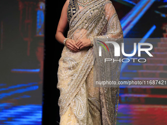 A model walks the ramp showcasing a designer collection during the 'Shaadiyan' season-5 fashion show in Jaipur, Rajasthan, India, on October...