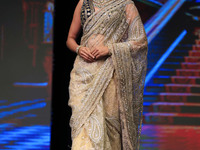 A model walks the ramp showcasing a designer collection during the 'Shaadiyan' season-5 fashion show in Jaipur, Rajasthan, India, on October...