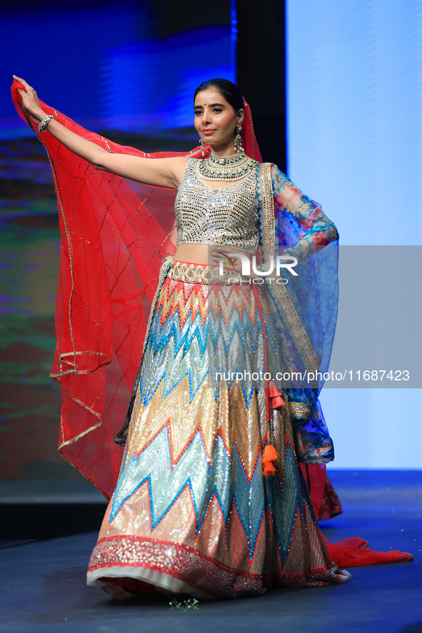 A model walks the ramp showcasing a designer collection during the 'Shaadiyan' season-5 fashion show in Jaipur, Rajasthan, India, on October...