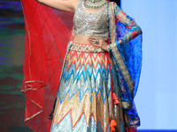 A model walks the ramp showcasing a designer collection during the 'Shaadiyan' season-5 fashion show in Jaipur, Rajasthan, India, on October...