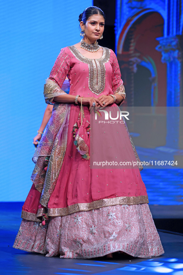 A model walks the ramp showcasing a designer collection during the 'Shaadiyan' season-5 fashion show in Jaipur, Rajasthan, India, on October...